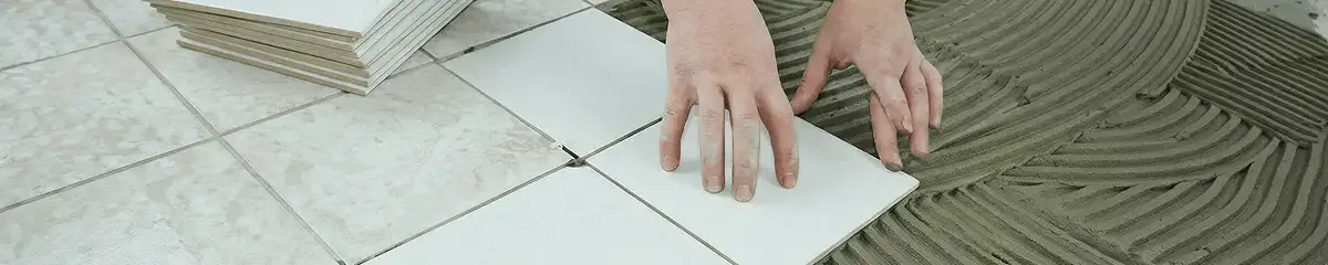 Professional installing white tile floors in Scottsdale, AZ