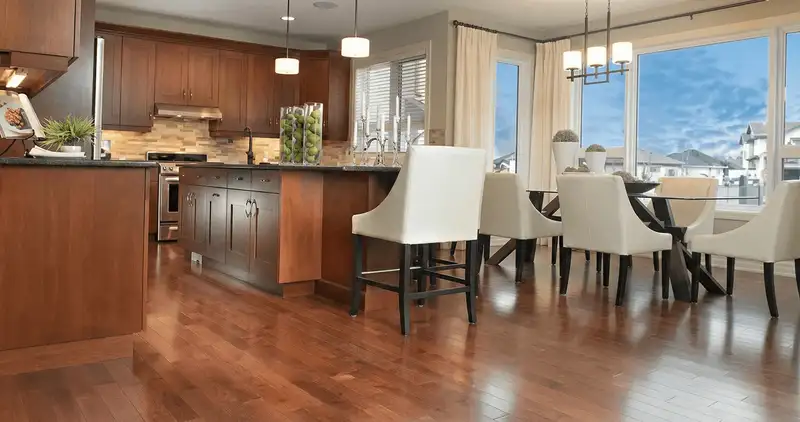 A modern kitchen with professionally installed wood flooring in Scottsdale, AZ